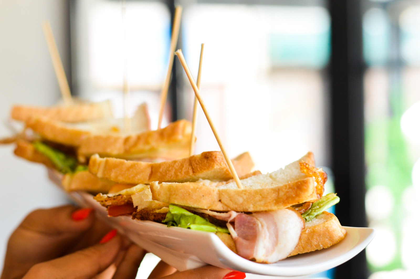 Club sandwich served at ElysiuM Kitchen & Bar
